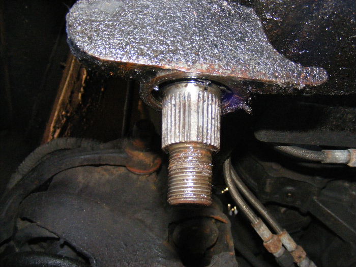 A leak from the bottom seal on the steering box like this is a common fault on these cabs.